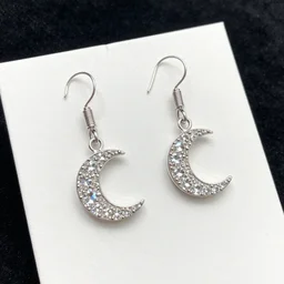 jewelry design, jewelry display, pair of crystal moon earring pendants