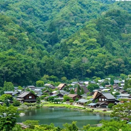 japanese village built around a lake with forest at the foot of green gigntic mountains at sunset, fireplace, hyperdetailed, artstation, cgsociety, 8 k