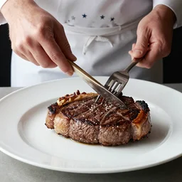 Tash Peterson eating a rib eye steak, food photography, Michelin star, high quality