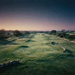 double exposure birds eye view of an infinite perfect elysian dreamlike green hilly pastoral psychedelic golf course landscape with stone walls under stars consisting of memory trapped in eternal time, golden hour, dark sky, evening starlight, stone walls, haunted psychedelic Polaroid by Hiroshi Yoshida