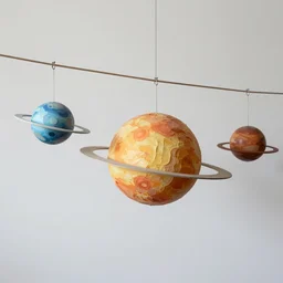 a kinetic sculpture of solar system hanging from horizontal line, canon 5 d 5 0 mm lens, papier - mache