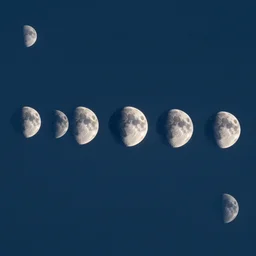 a multilunar skyline view with ten different sizes and separate moons