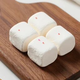 photograph of a delicious marshmallow cube with sprinkles on a dark wooden chopping board, pastel colours, hessian cloth, styled food photography, photorealistic, 4 k, canon 1 d, bohek