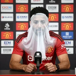 BBC Sports photograph of a Manchester United press conference introducing their new signing, a ghost