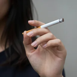 a girl's hand holding a cigarette, to preserve the structure of the structure of the hand, photograph, hyperrealistic, 8k