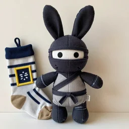 a dark ninja rabbit plush doll hand stitched from an old sock, photography, photorealistic, national geographic