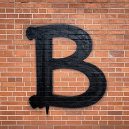 the letter b graffitied on a brick wall
