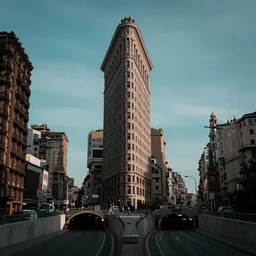 flatiron building and gotthard road tunnel, wide establishing shot, dark teal lighting, soft dramatic lighting, sharp focus, 4 k digital camera