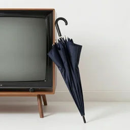 an umbrella leaning against a television