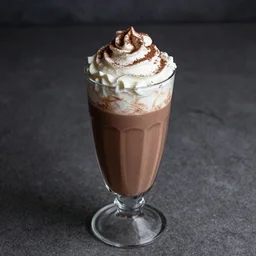 food photography of hot chocolate drink in tall glass with cream on top and cocoa powder, canon macro lens, moody lighting - n 9