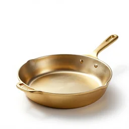 gilded cast iron skillet, studio product photography, isolated on a pure white background, centered, entire object in frame, sharp focus, soft studio lighting