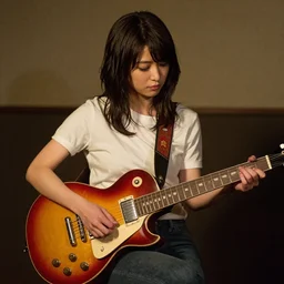 real-life Yui Hirasawa with a Gibson Pre-'08 Les Paul Standard '50s, a still of a Japanese music movie
