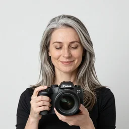 woman with grey hair, peaceful expression, medium shot, canon eos r 3, f / 1. 4, iso 2 0 0, 1 / 1 6 0 s, 8 k, raw, unedited, symmetrical balance