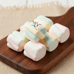 photograph of a marshmallow cube with sprinkles and on a dark wooden chopping board, pastel colours, hessian cloth, styled food photography, photorealistic, 4 k