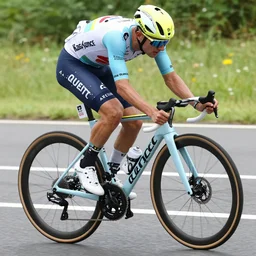 bike rider with prosthetic leg in the tour de france, prosthetic leg = pickle rick, action shot, high quality photograph, high resolution