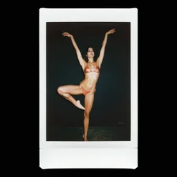 a woman in a bikini posing for a picture, a polaroid photo by michelangelo, instagram, arabesque, hd, black background, sensual