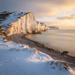an award winning landscape photo of Cuckmere Haven, Seven Sisters, long exposure, golden hour, snowy, winter, beautiful, landscape photographer of the year