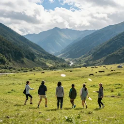 friends playing frisbee on a mountain slope in a mountain valley with a scenic view of a valley behind you can see horses and tractors in distance the sun rays are cutting through the white clouds the whole of an image has a description in hiragana