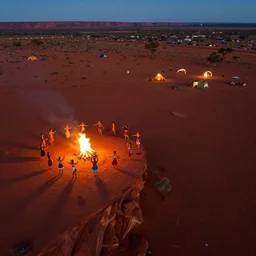 stunning night aerial photograph of dancers on the edge of the red australian desert, bonfire, accurate bodies, campsites, diverse costumes, 8 k, ultra clear detailed