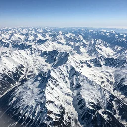 tall mountains covered in snow, photo from airplane by Ansel Adams,