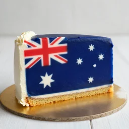 slice of birthday cake with the pattern of the australian flag on the side