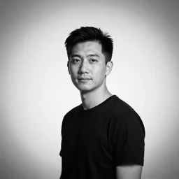 A large-format portrait of a man behind a white backdrop, spot-lighting, depth of field, high contrast, black and white