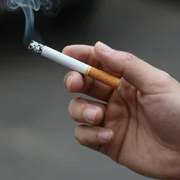 Close-up of thin soft hand holding cigarette in it with smoke, hyper realistic, high details, photo, super resolution