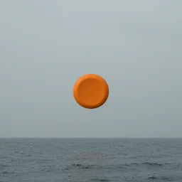photo of sea and gray sky with an orange sauce spot in the middle