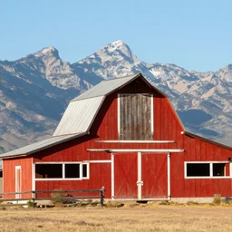 photo of a red barn in direct sunlight, mountains in the background, in arizona, award winning