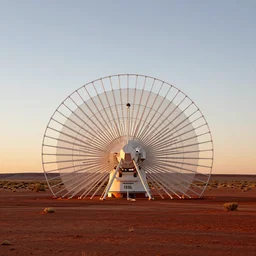 radial shaped, electrostatic atmospheric water condenser and collector, nikoa tesla antenna array technology, in the red australian desert, dawn's natural light, high quality photograph, shallow depth of field, simple composition, symmetrical,