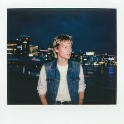 polaroid of kurt cobain in seattle, raining! nighttime