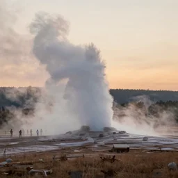 photo of misty morning at yellowstone park geyser erupting at sunrise award winning photograph old faithful national geographic