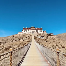 landscape of clear azure sky, tibetan temple on the top of a mountain with a woooden and rope bridge arriving to their main door, art by artgerm and greg rutkowski and alphonse mucha, concept art, octane render, highly detailed