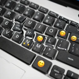 keyboard with emojis instead of characters. dslr photo.