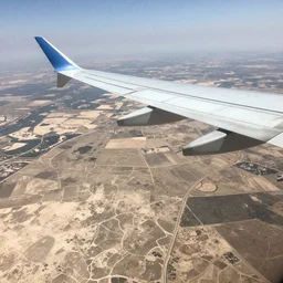 Travel Ad, plane flying above a drying landscape