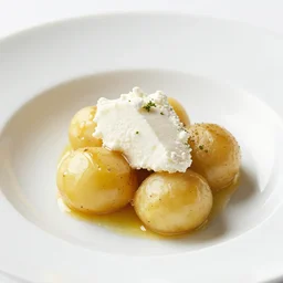 dslr photograph of a michelin starred restaurant dish consisting of potatoes, goat cheese and honey foam, 4 0 mm f 2