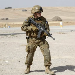 willem dafoe wearing an israeli defense force uniform and holding an m16 rifle, full body shot