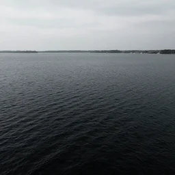 lake with black water view from above, sky