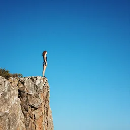 a girl standing on the edge of a cliff, staring into a blue particle void, about to jump in it, 4k detailed
