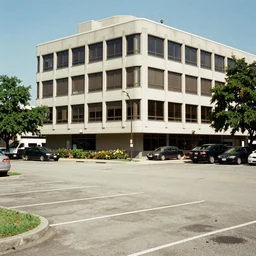 parking lot beside four storey office building high dynamic range kodakchrome old - school - cool