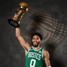 jayson tatum lifts a championship trophy.
