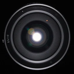 a small soft, detailed lens flare, point of light, rings, vfx on black background