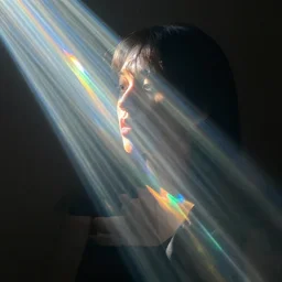 “Kio the prismatic person, refracted light, caustics, light rays shining through, 4k photo, 35mm”