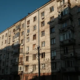 Photo of Soviet apartment building, slums, tangled wires