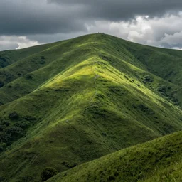 a large green hill with no trees on it.