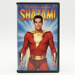 1990s photo of a vhs tape cover graphic for the movie “Shazam” starring comedian Sinbad as a genie