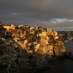city on a cliff, small city on hillside cliff, golden hour