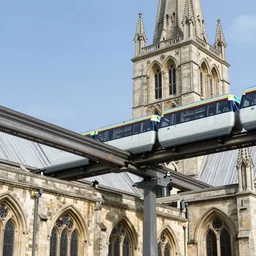 an external view of salisbury cathedral with a monorail train system running through its roof, photograph, architectural photo, modern stransport system, public transport - n 4