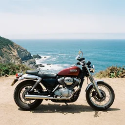 a photography of a motorcyle parked on a cliff overlooking the pacific ocean. 3 5 mm with kodak ektar 1 0 0 film