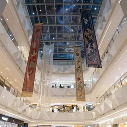 polygonal minimalist mall with giant walls and glass ceilings showing the stars and hanging silk drapery and tapestries, light dust, magnificent, close up, details, sharp focus, elegant, highly detailed, illustration, by Jordan Grimmer and greg rutkowski and PiNe(パイネ) and 薯子Imoko and 香川悠作 and wlop and maya takamura, intricate, beautiful, Trending artstation, pixiv, digital Art